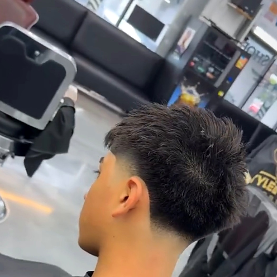 Young client's taper fade at Styled by Sanky Barbershop